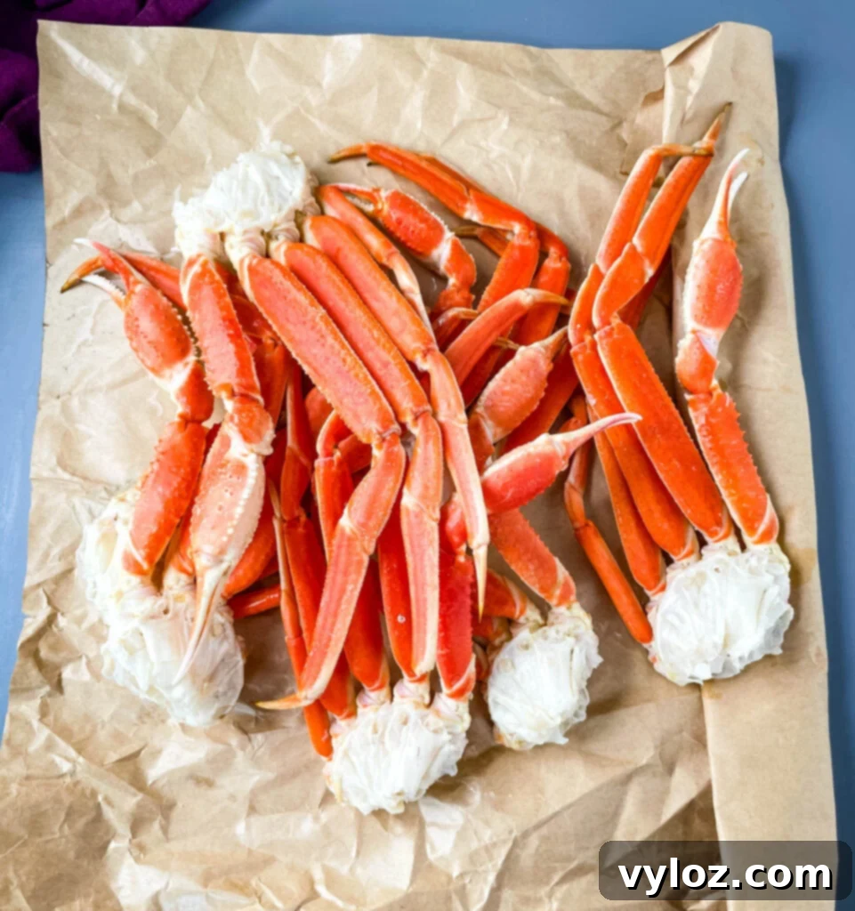 Decadent Garlic Butter Crab 4 snow crab legs on a flat surface