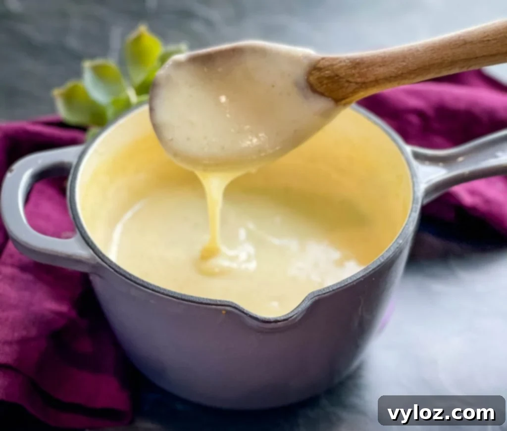 Creamy Cheesy Slow Cooker Chicken and Rice 4 Homemade cream of chicken soup simmering in a saucepan