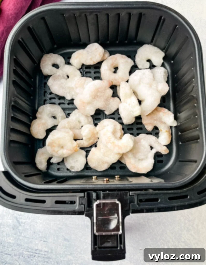 Crispy Air Fryer Frozen Shrimp 4 Frozen shrimp in air fryer basket