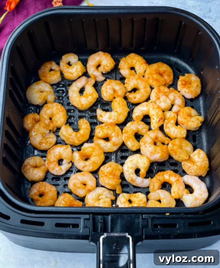 Crispy Air Fryer Frozen Shrimp 6 Cooked frozen shrimp in air fryer basket