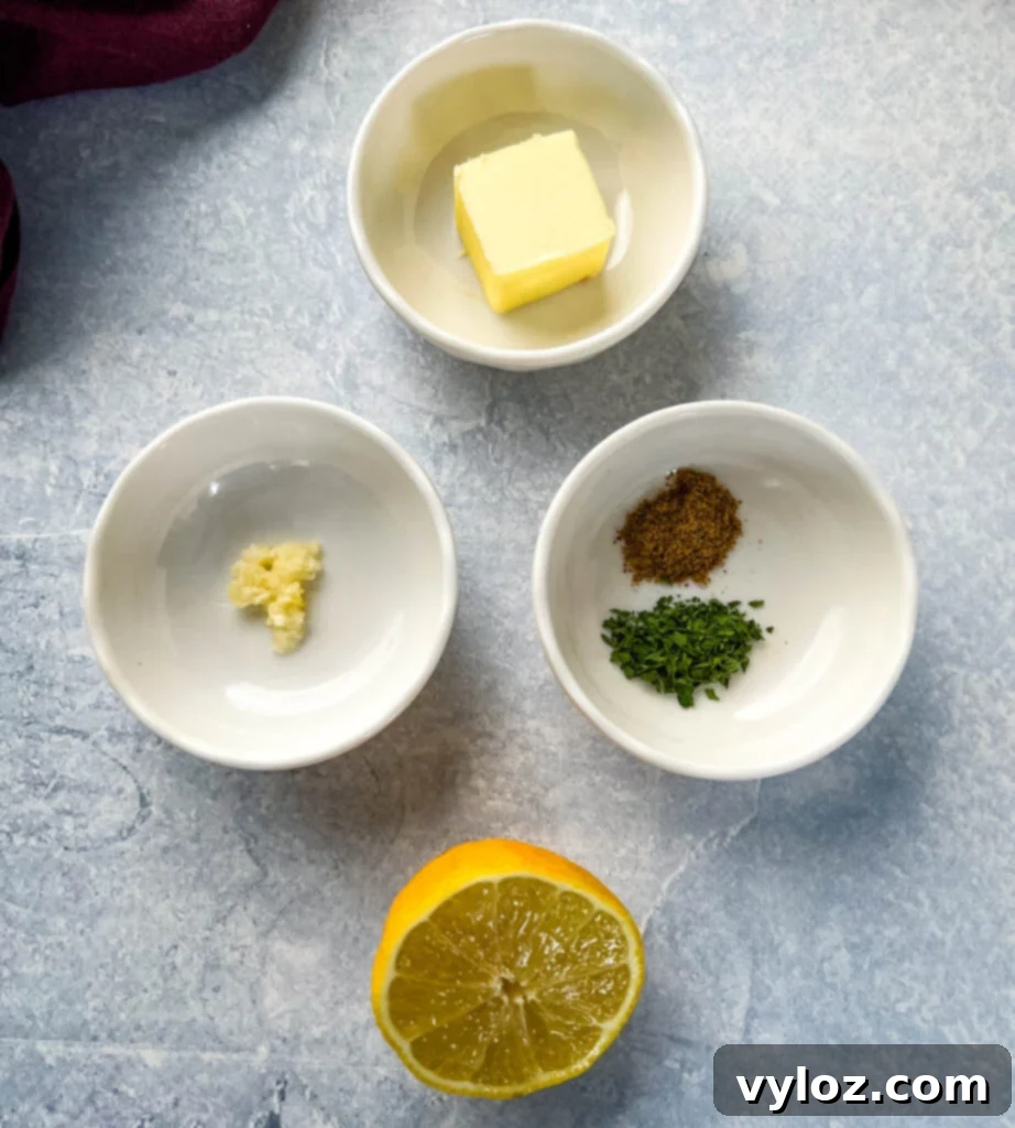 Perfect Air Fryer Lobster Tails 4 butter, garlic, parsley, lemon, and Old Bay Seasoning in separate bowls