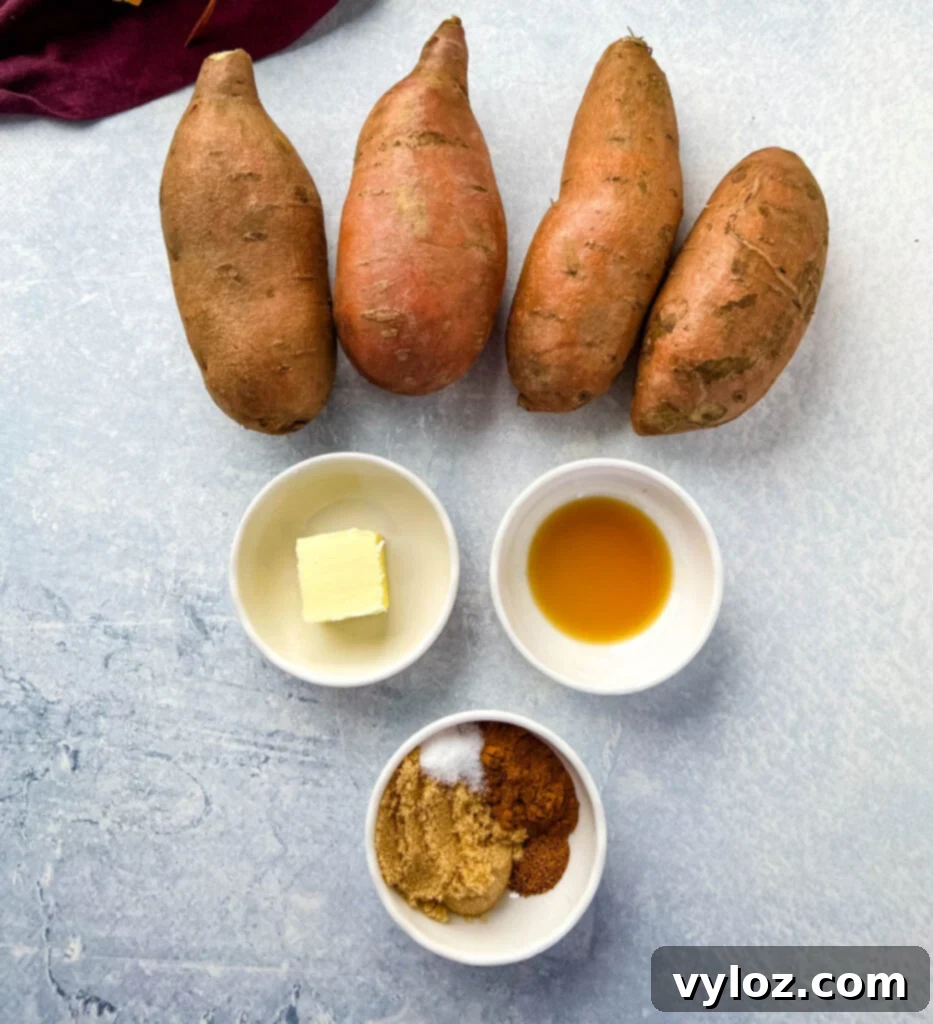 Various ingredients for mashed sweet potatoes: raw sweet potatoes, butter, vanilla extract, cinnamon, nutmeg, and brown sugar in separate bowls