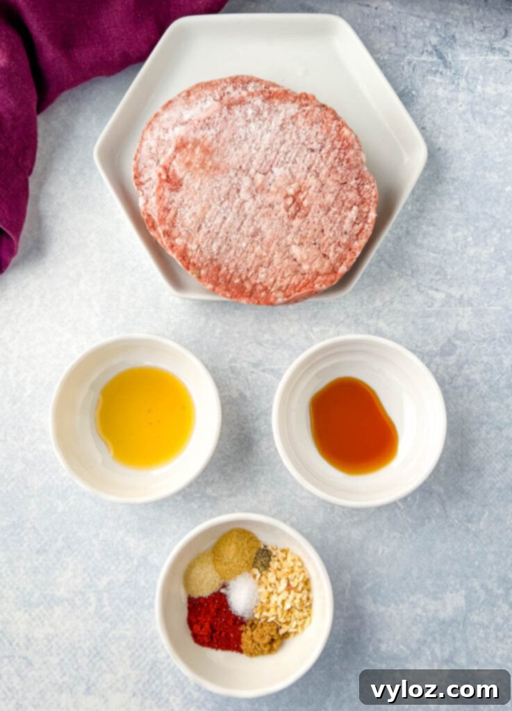 Crispy Air Fryer Frozen Burgers: From Freezer to Plate 3 frozen burgers, liquid smoke, worcestershire sauce, and burger seasoning in separate bowls