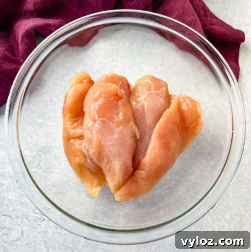 Blazin' Nashville Tenders 4 raw chicken tenderloins in a glass bowl