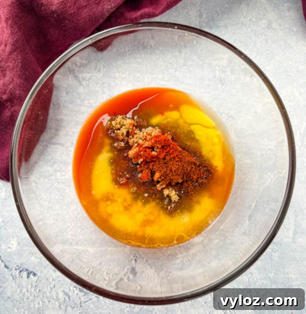 Blazin' Nashville Tenders 6 Nashville hot chicken sauce in a glass bowl