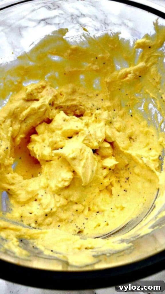 deviled egg mixture in a glass bowl