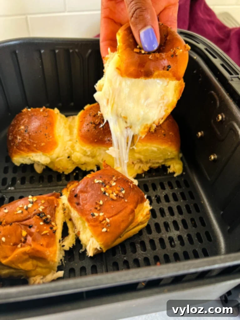 Cheesy Turkey Sliders 11 Close-up of golden brown turkey cheese sliders, perfectly cooked in an air fryer