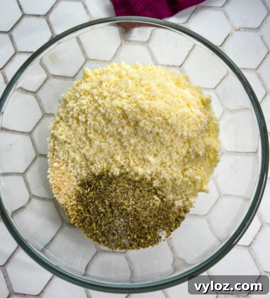 breadcrumbs and parmesan cheese in a glass bowl