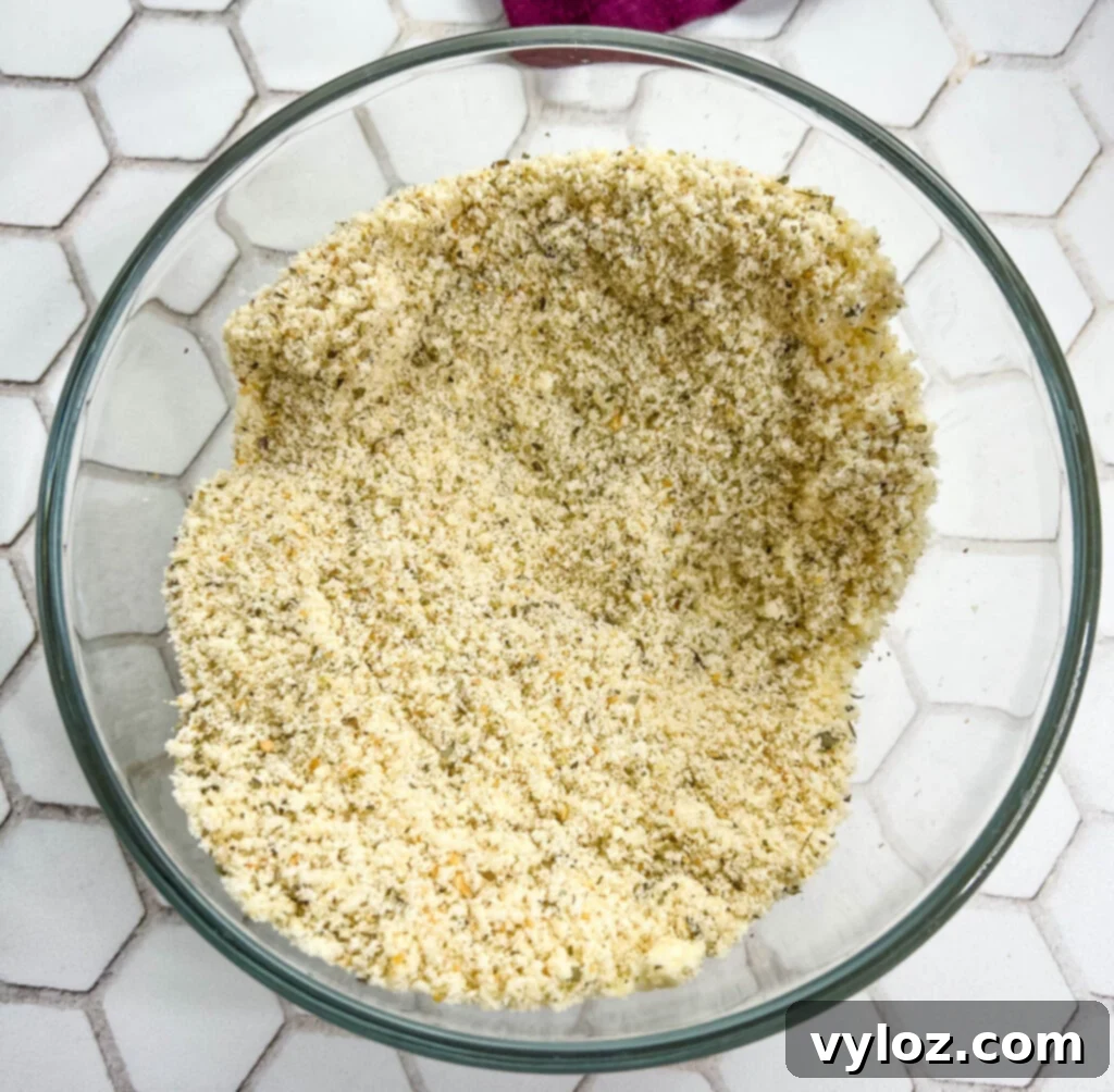 breadcrumbs and parmesan cheese in a glass bowl