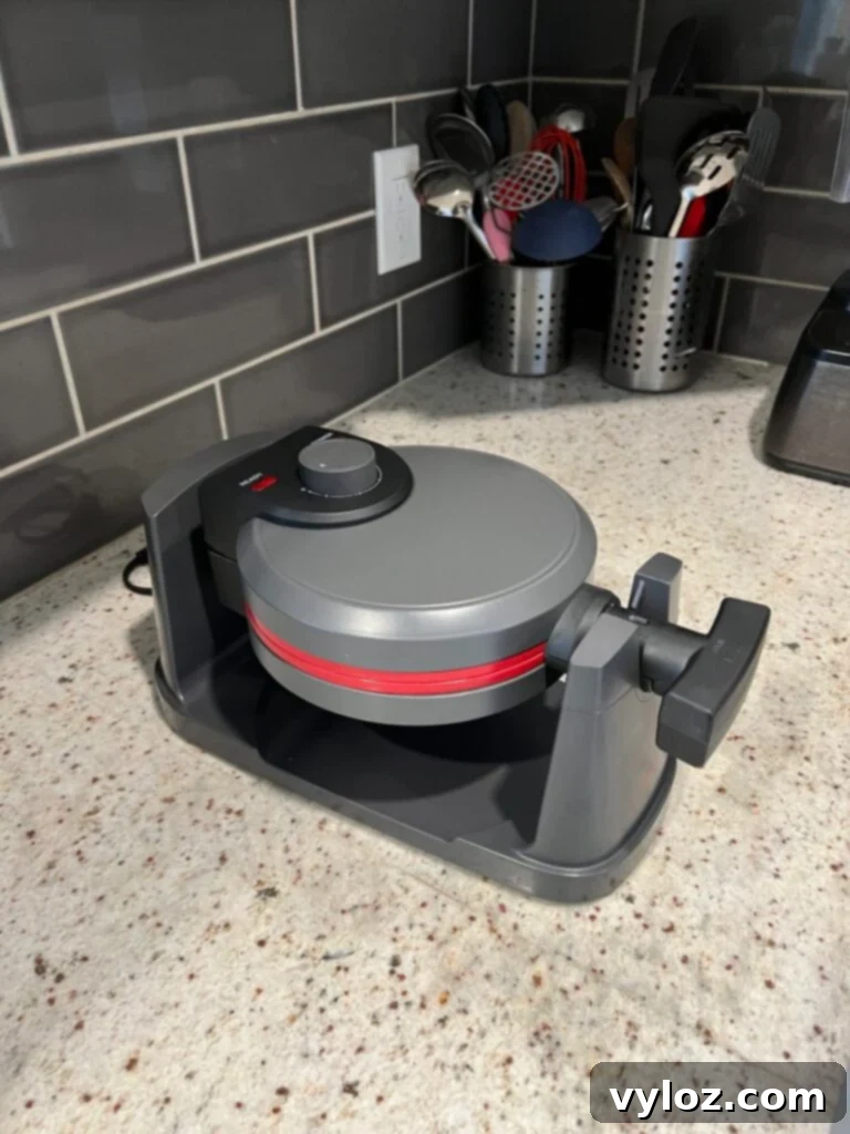 Elegant dining table set with white floral embroidered tablecloth, stoneware flower serving set, and woven placemats, ready for holiday hosting.
