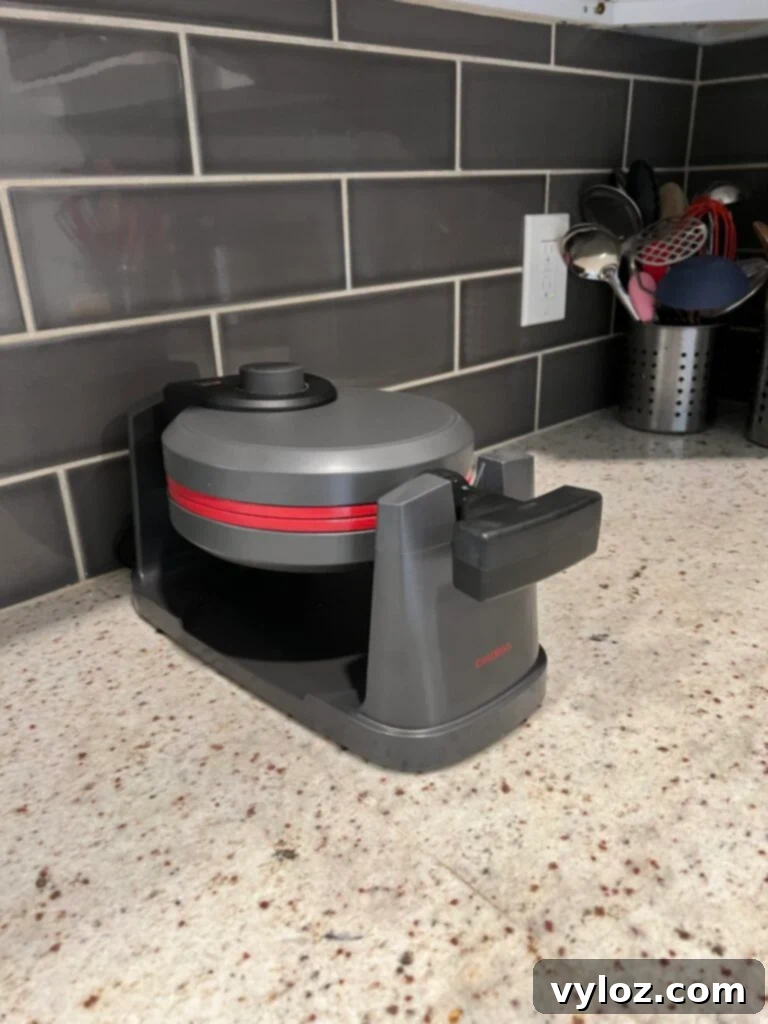 Detail of a woven plastic floral placemat in a natural tone, adding texture and a touch of elegance to a holiday table setting.