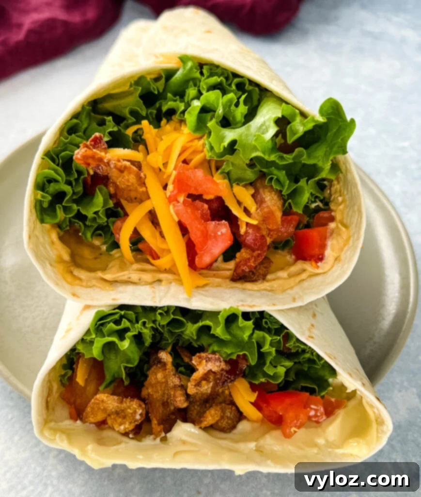 Quick BLT Wrap 2 blt wrap with bacon, lettuce, tomato, and mayo on a plate