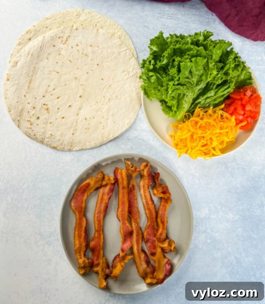 Quick BLT Wrap 3 tortilla, cooked bacon, lettuce, tomatoes, and cheese on separate plates