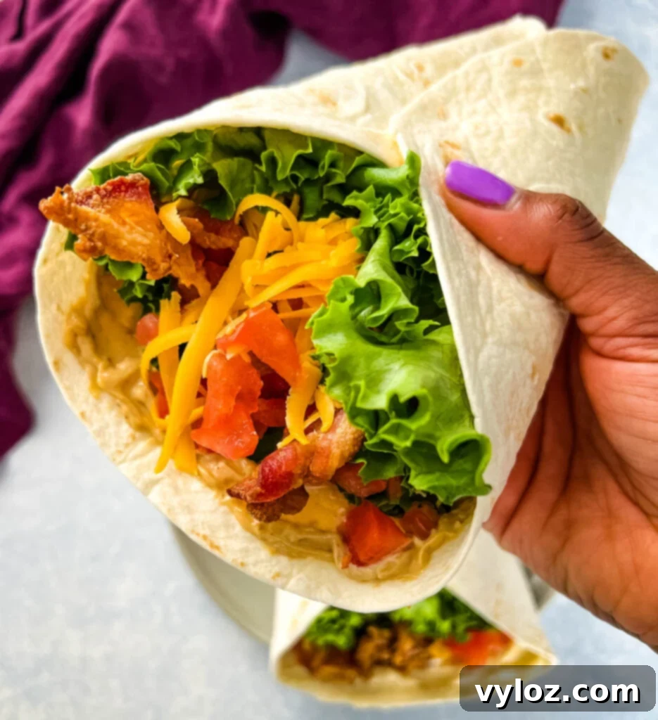 Quick BLT Wrap 7 person holding BLT wrap