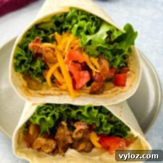 Quick BLT Wrap 8 blt wrap with bacon, lettuce, tomato, and mayo on a plate