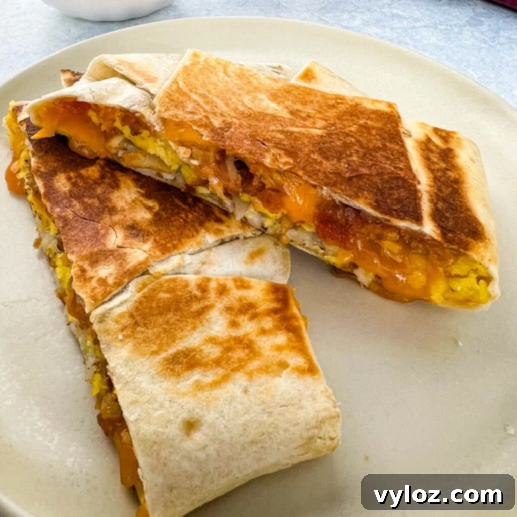 Crispy homemade breakfast crunchwrap on a plate, ready to be enjoyed.