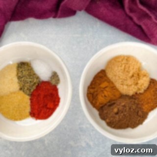 A collection of vibrant spices arranged in separate white bowls, ready to be blended into a homemade jerk seasoning dry rub.
