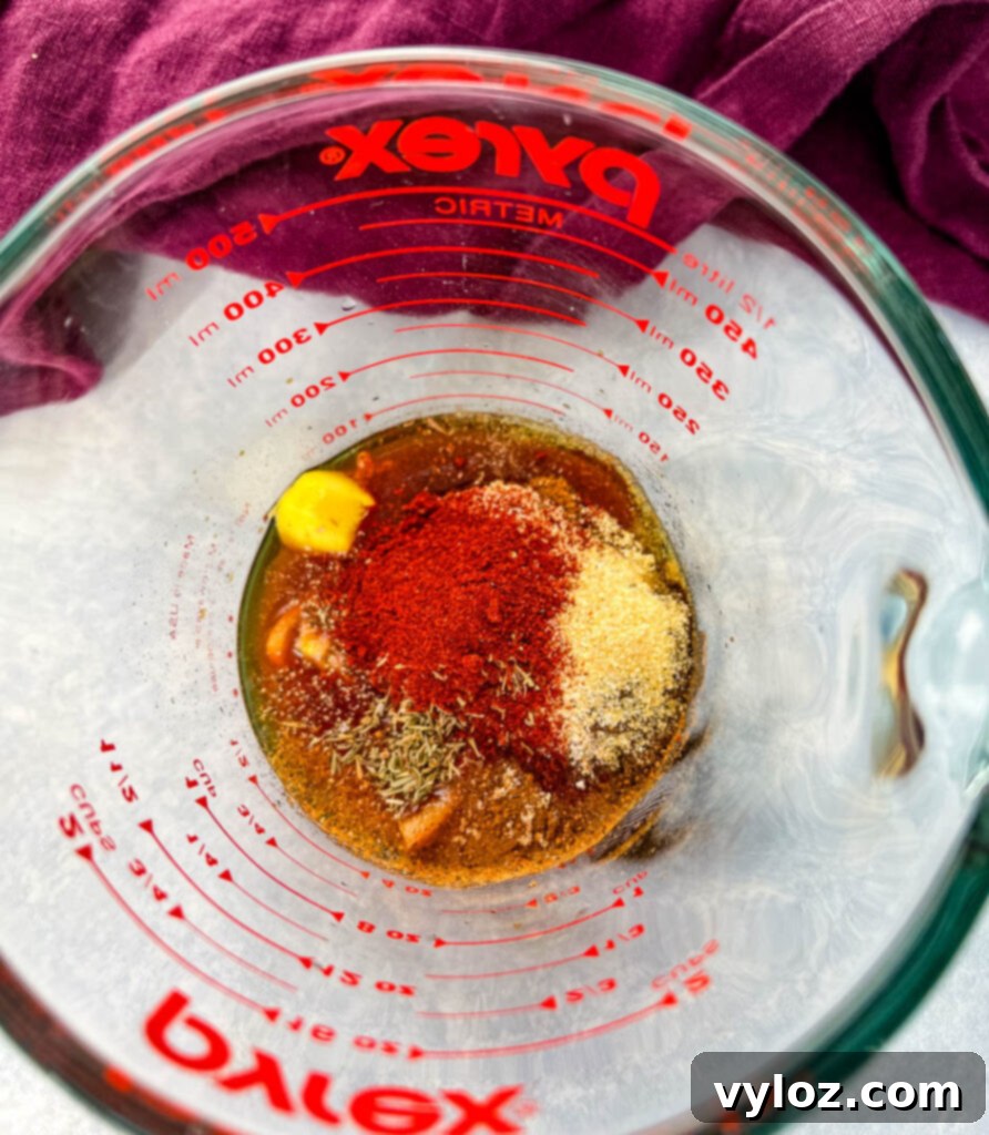 Effortless Caribbean Shrimp 5 jerk marinade in a glass measuring cup