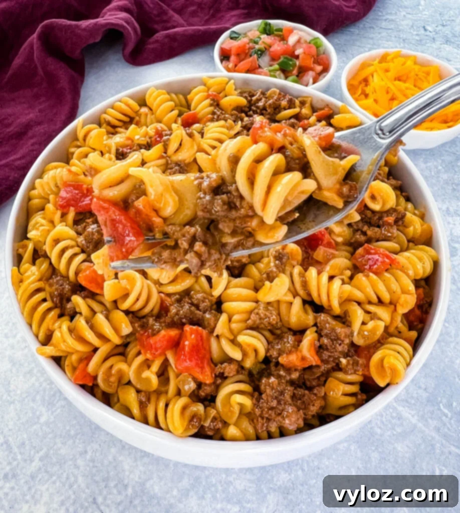 cheesy taco pasta in a fork