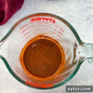 Bold Caribbean Jerk Marinade 8 Jerk marinade in a glass measuring cup, representing the finished recipe.