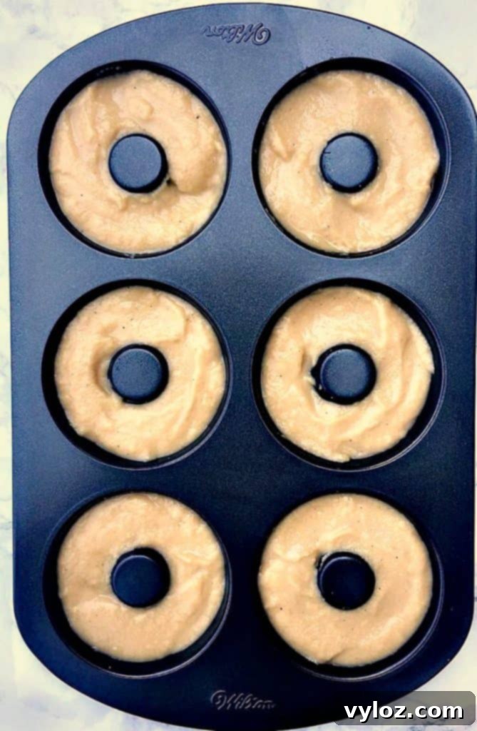 protein donut mix in a donut maker pan