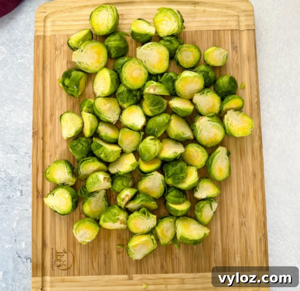 Caramelized Garlic Brussels Sprouts 4 Halved raw Brussels sprouts on a wooden cutting board