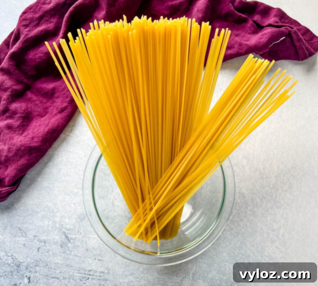 uncooked pasta in a glass bowl