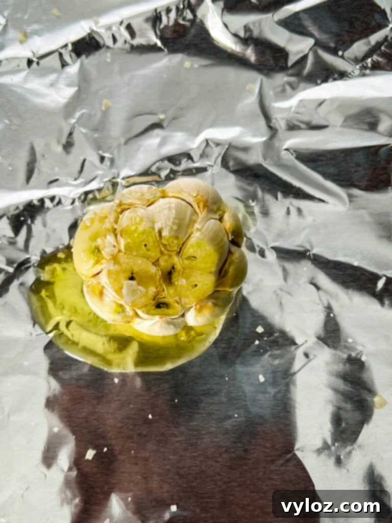 garlic on foil drizzled with olive oil