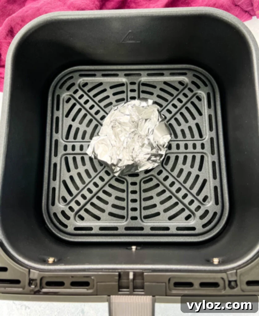 garlic wrapped in foil in an air fryer