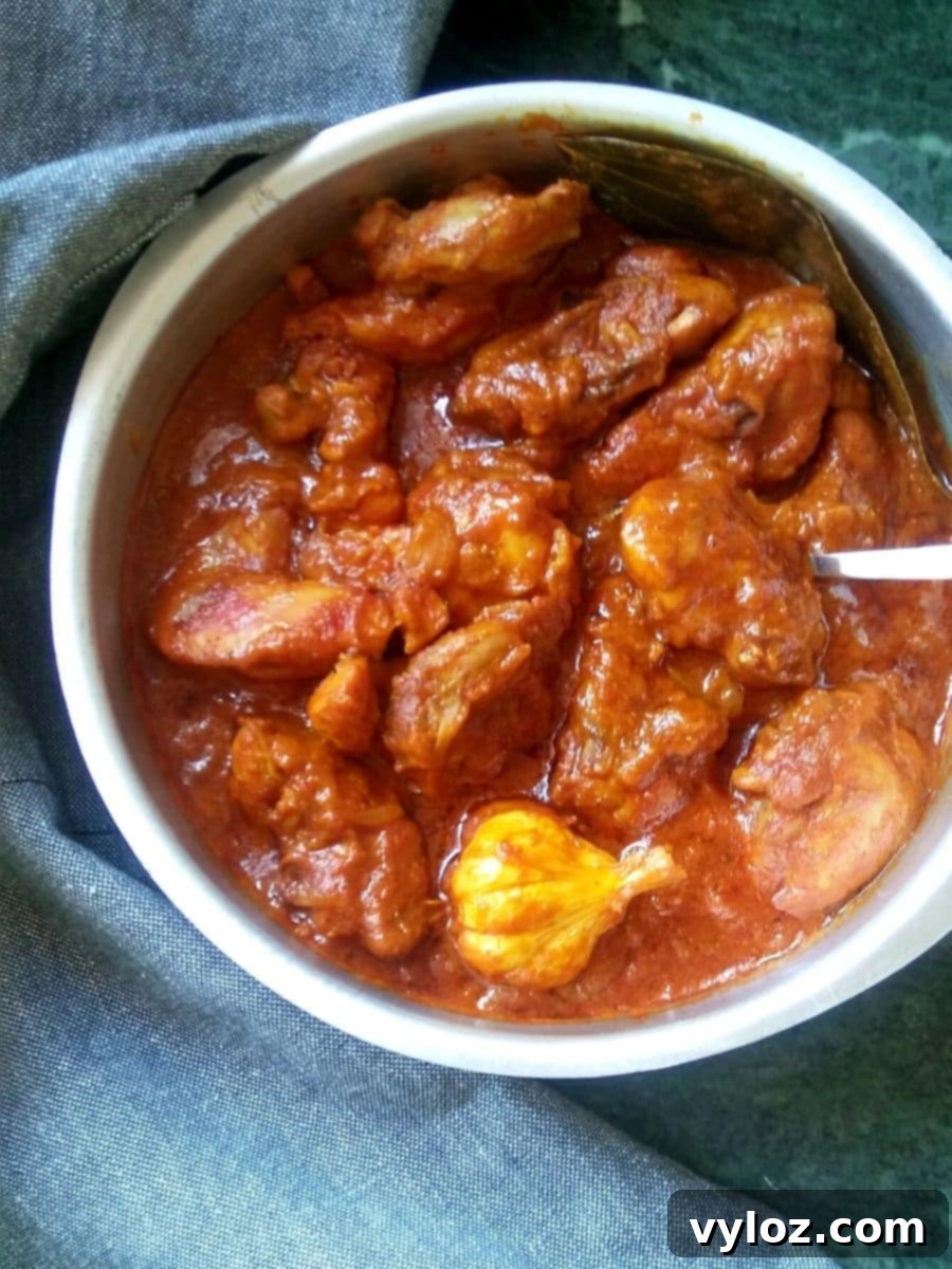 Rich and spicy Bihari Style Chicken Curry, featuring whole garlic knobs