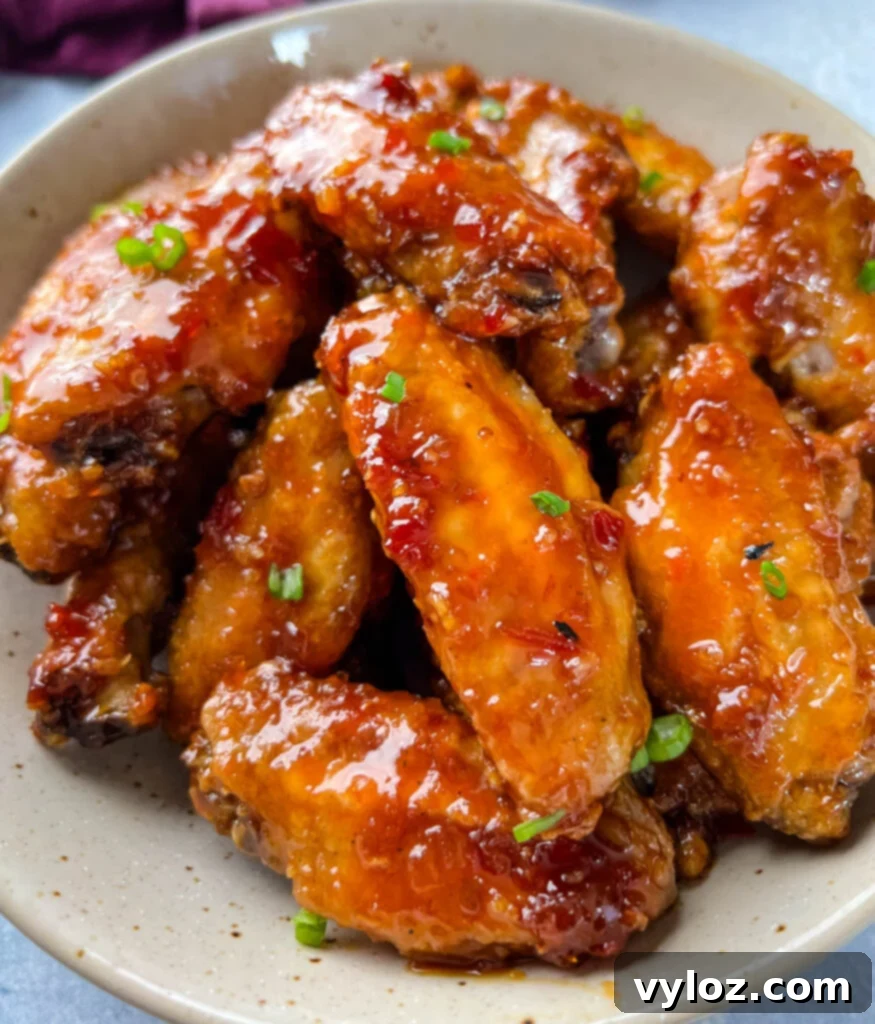 Sweet Chili Chicken Wings: A Flavorful Journey 11 sweet chili wings in a serving bowl, garnished