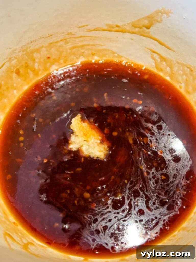 Sweet Chili Chicken Wings: A Flavorful Journey 5 sweet chili sauce simmering in a pot