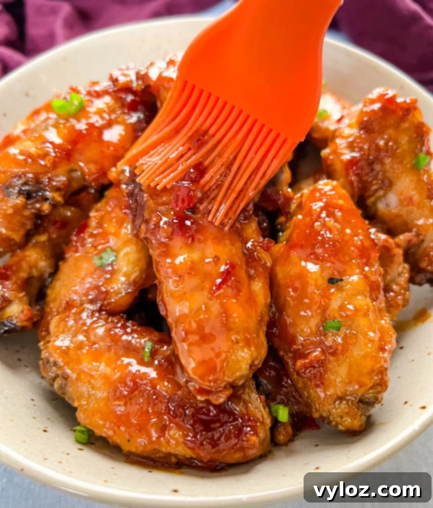 Sweet Chili Chicken Wings: A Flavorful Journey 10 sweet chili chicken wings brushed with sauce, close-up