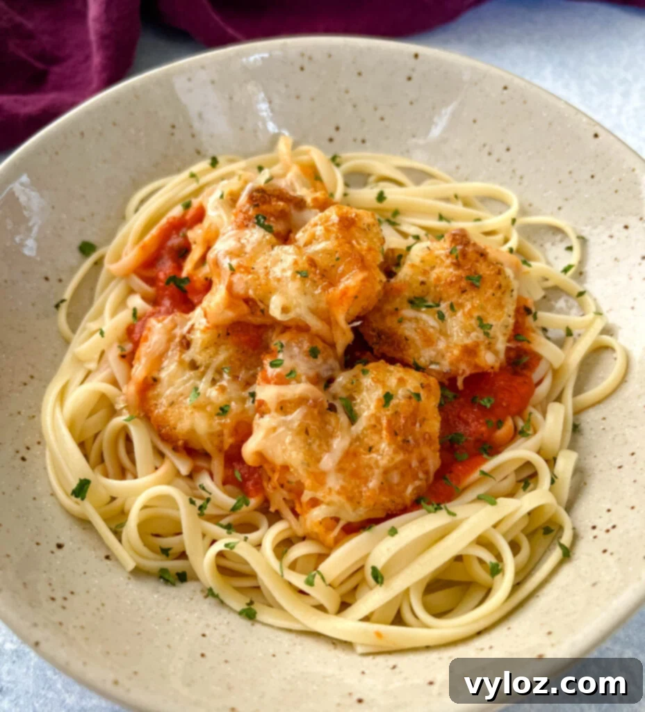 Crispy Shrimp Parmesan with melted mozzarella and pasta