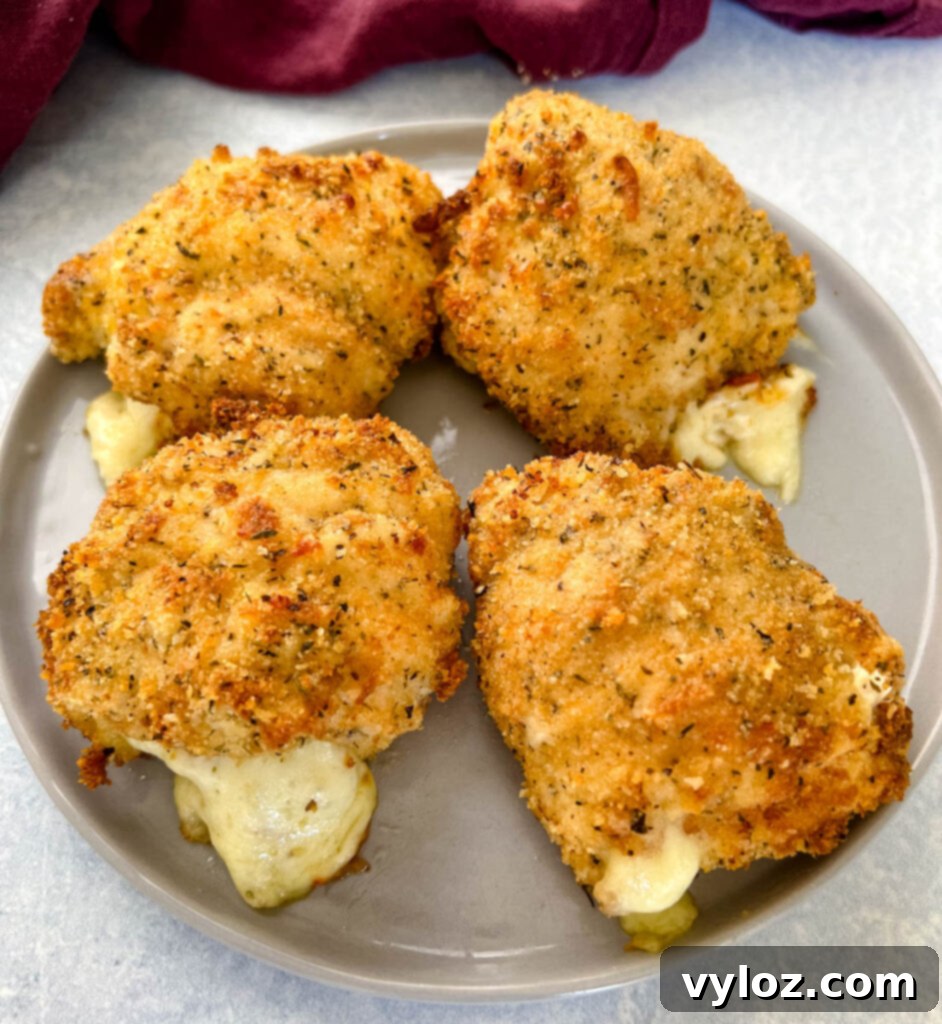 mozzarella stuffed chicken breasts on a plate