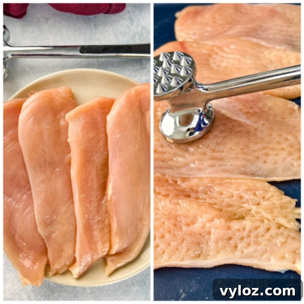 raw chicken breasts pounded with a mallot