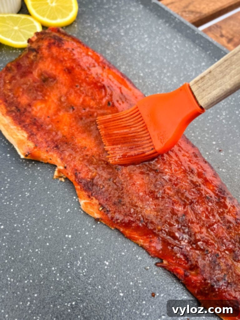 Ultimate Traeger Smoked Salmon 9 Finished Traeger smoked salmon generously brushed with a sweet and tangy BBQ sauce glaze.