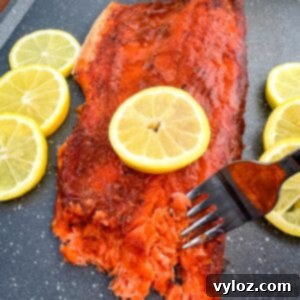 Ultimate Traeger Smoked Salmon 10 Traeger smoked salmon on a plate with fresh lemons