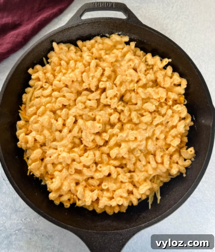 uncooked smoked mac and cheese in a cast iron skillet