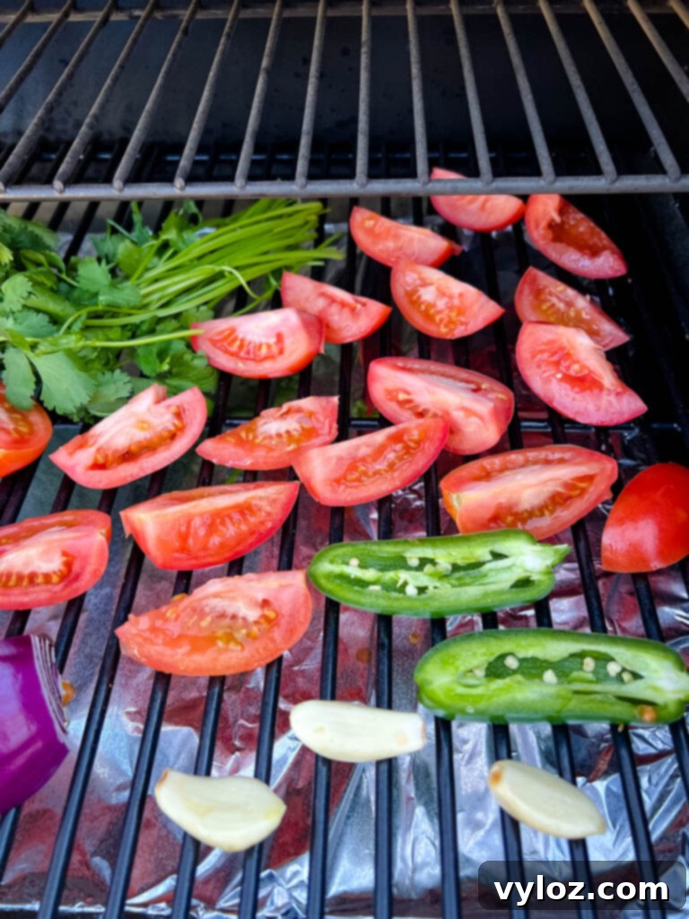 Smoky Salsa Secrets 5 Close-up shot of fresh tomatoes, red onions, garlic cloves, and cilantro beautifully arranged on a smoker grate, capturing the pre-smoke preparation.