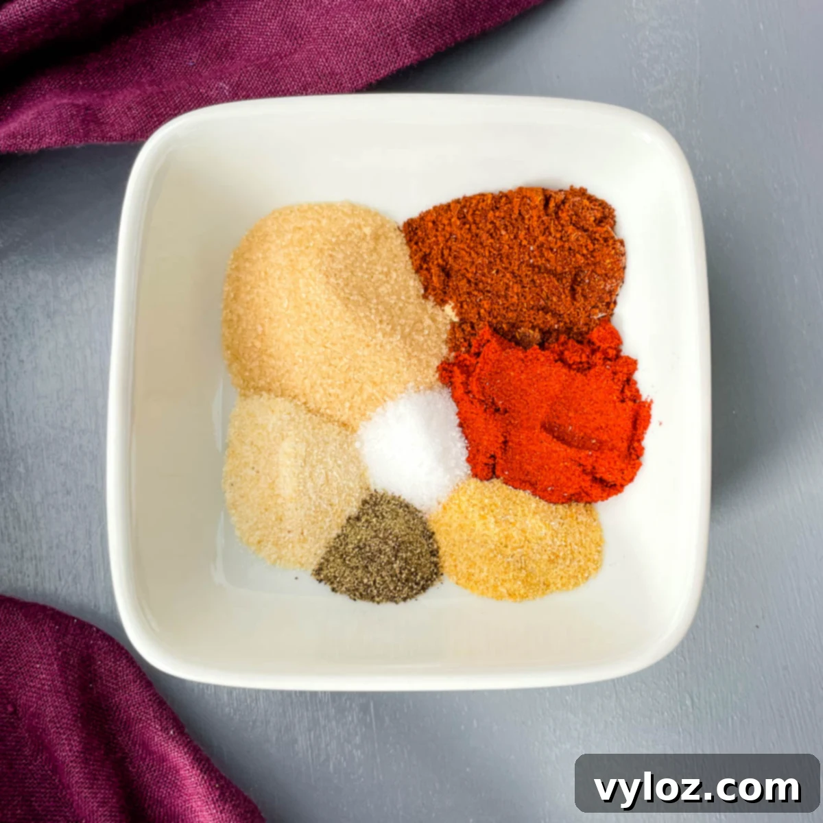 spices for chicken dry rub in a white bowl