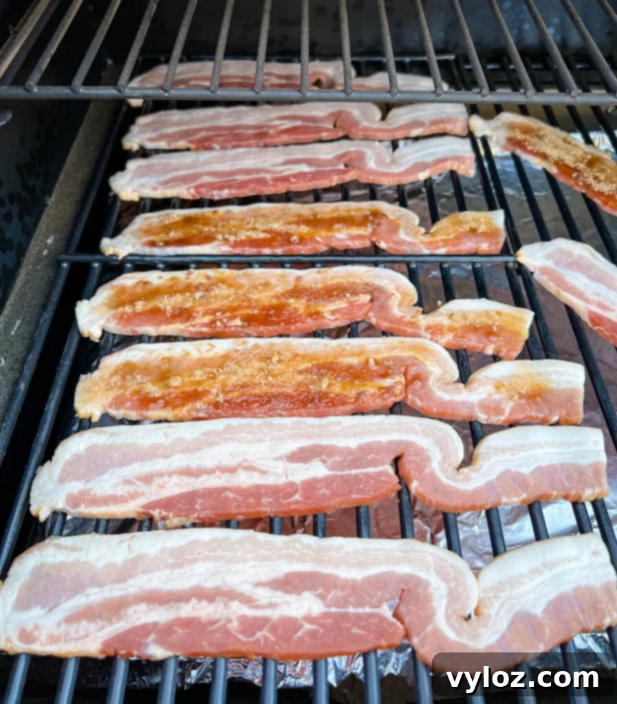 Ultimate Traeger Smoked Bacon 7 uncooked bacon on a Traeger smoker