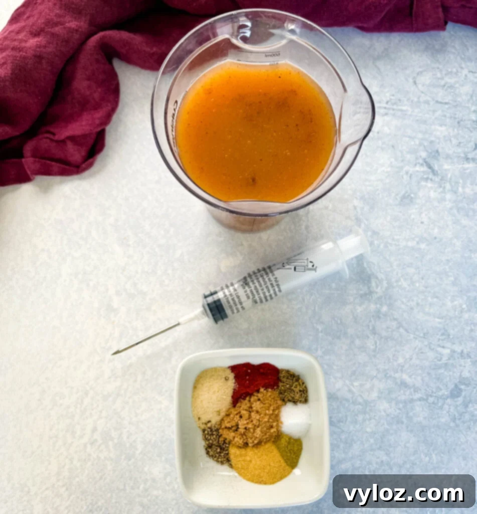 Smoked Spatchcock Turkey on the Traeger 6 A selection of turkey injection marinade, butter, and dry spices laid out for seasoning.