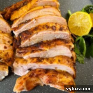 Juicy Traeger Smoked Turkey Breast 11 slices of smoked turkey breast on a pan