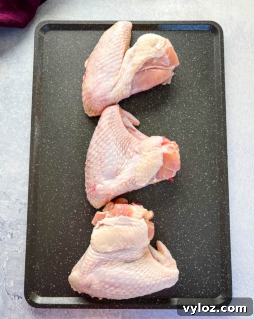 raw whole turkey wings on a pan