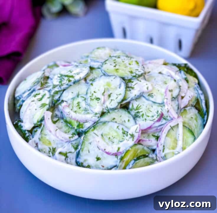 Creamy cucumber salad with red onions, dill, and a yogurt-based dressing