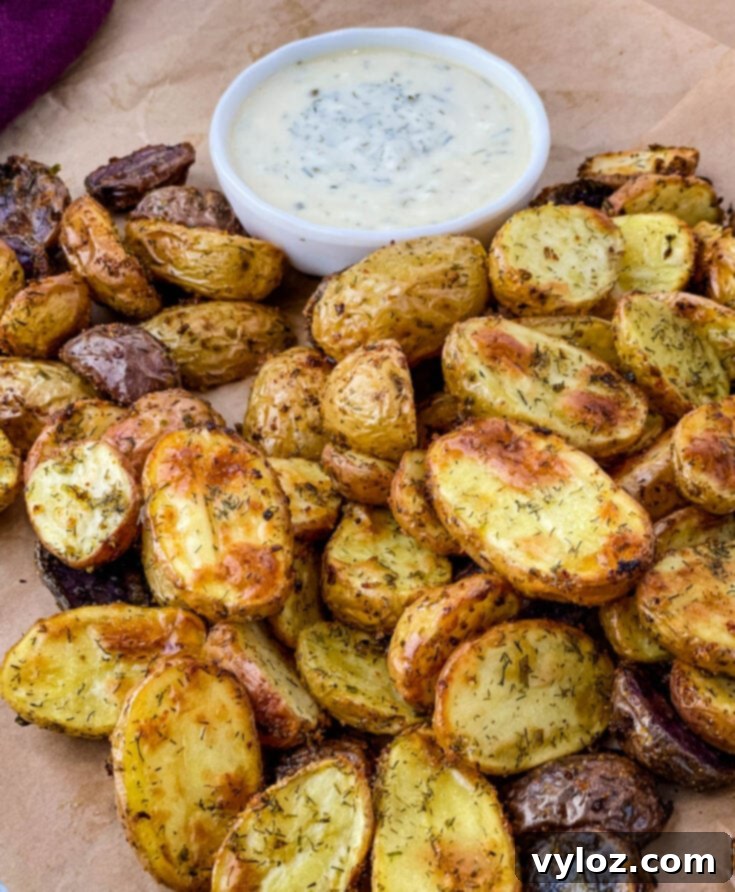 Crispy roasted ranch potatoes seasoned with herbs in a serving bowl
