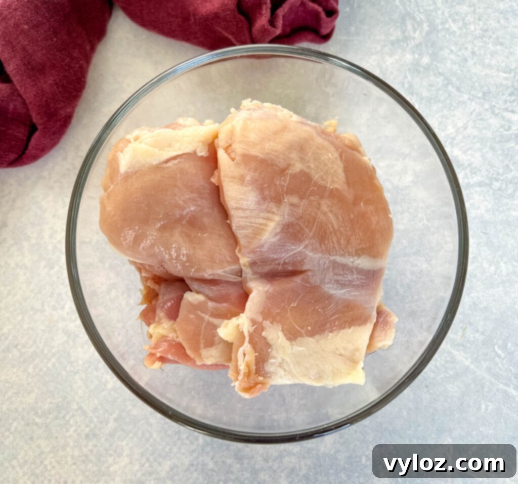 boneless skinless chicken thighs in a glass bowl