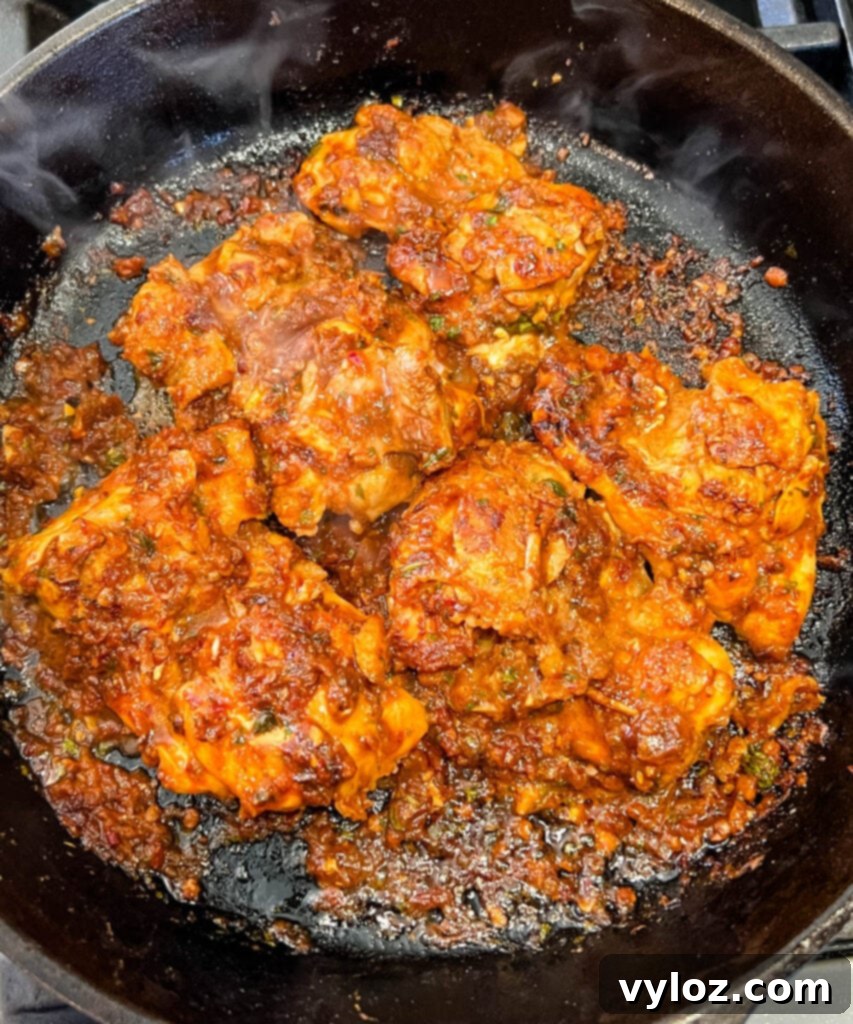 pollo asado in a cast iron skillet