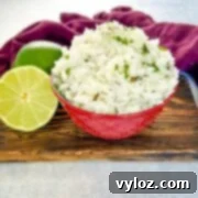 Chipotle cilantro lime rice in a bowl with fresh limes